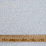 Piqué de coton imprimé fleurs printanière fond bleu clair