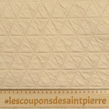 Jersey matelassé triangle fond beige clair