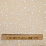 Piqué de coton imprimé étoiles fond beige