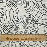 Popeline de coton imprimée escargot noir fond beige clair