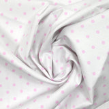 Piqué de coton imprimé pois rose fond blanc