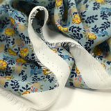 Crêpe de polyester imprimé micro pousses marine fond bleu