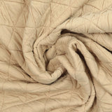 Jersey matelassé triangle fond beige clair