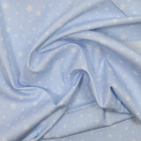 Estrellas de estampado de algodón Fondo azul claro