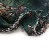 Mousseline imprimée crinkle feuilles et fleurs marron et vert fond pétrole