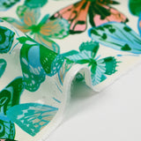 Viscose imprimée jacquard papillons bleus et verts fond blanc