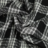 Jacquard de laine mélangée à carreaux écru fond noir