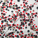 Satin de coton élasthanne dans les bulles rouge fond blanc