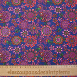 Cotton corduroy printed with psychedelic flowers indigo background