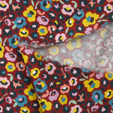 Pana de algodón estampado flores fondo leopardo burdeos