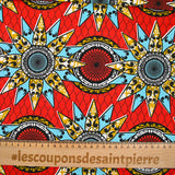 Coton imprimé ethnique Eindhoven bleu et ocre fond rouge