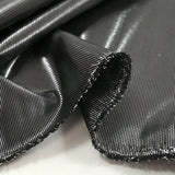 Lamé de polyester rayé argent fond noir