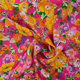 Viscose imprimée fleurs orange fond fuchsia