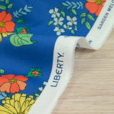 Coton liberty ® Tropical Sprig fond bleu au mètre