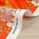 Coton liberty ® Tropical Sprig fond corail au mètre