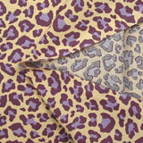 Coton imprimé léopard violet fond jaune beurre