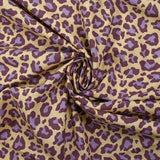 Coton imprimé léopard violet fond jaune beurre