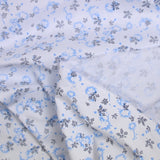 Popeline polycoton imprimée camouflage bleu