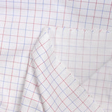 Popeline polycoton tissée-teinte pointillé rouge et bleu fond blanc
