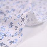 Popeline polycoton imprimée camouflage bleu