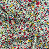 Coton imprimé Aurora fleurs rouge et jaune fond blanc au mètre