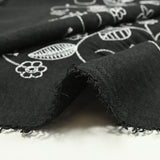 Twill de polyester brodé Solène fond noir