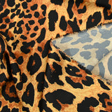 Satin polyester imprimé léopard fond doré