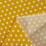 Coton imprimé étoile 1cm moutarde