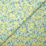 Piqué de coton imprimé les fleurs de Sarah bleu et jaune fond blanc