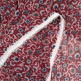 Mousseline crinkle imprimée fleurs fond lie de vin