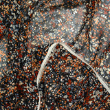 Mousseline imprimée cravate dorée fond noir