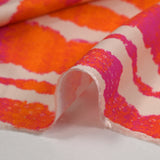 Viscose imprimée rayée effet tie & dye orange et fuchsia