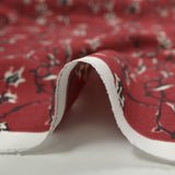 Crêpe viscose imprimé lien floral fond bordeaux