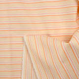 Popeline de coton tissée-teinte rayée orange fond pêche