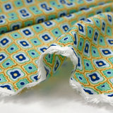 Viscose imprimée fleurs graphiques marine fond jaune beurre
