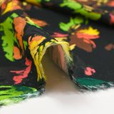 Viscose imprimée gribouillis de fleurs fond noir