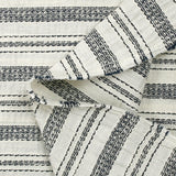 Coton tissé-teint rayé brodé marine fond blanc cassé