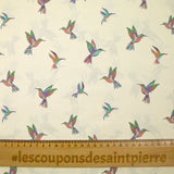 Coton imprimé envolée de colibris fond écru