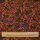 Viscose imprimée léopard orange fluo fond marron