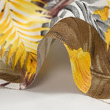 Polycoton imprimé jungle de feuilles jaune et marron fond blanc