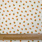 Jersey pointelle coton imprimé orange fond blanc cassé