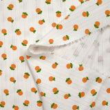 Jersey pointelle coton imprimé orange fond blanc cassé