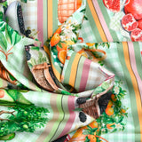 Coton imprimé frise vitaminée orange et vert