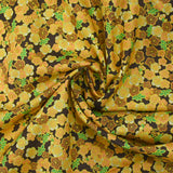 Cotton printed with yellow cherry blossoms, brown background