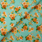 Popeline de coton imprimée bouquet orange fond vert d'eau
