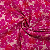 Popeline de coton imprimée fleurs en fusion fuchsia et magenta fond écru