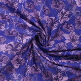 Cotton poplin printed silhouette in lilac flowers indigo background