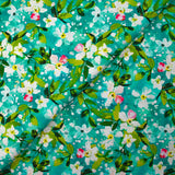 Popeline de coton imprimée jasmin fond turquoise