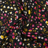 Popeline de coton imprimée tiges de fleurs jaune et fuchsia fond noir