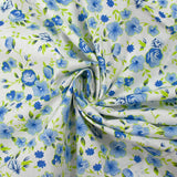 Popeline de coton imprimée fleurs du temps bleu et vert anis fond blanc
